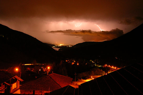 View of the valley toward Cles during a summer storm