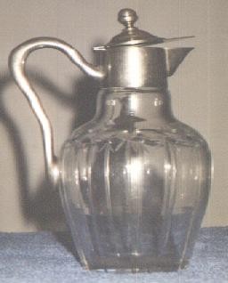 glass and silver claret jug
